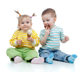 happy children little girl and boy with ice cream in studio isol