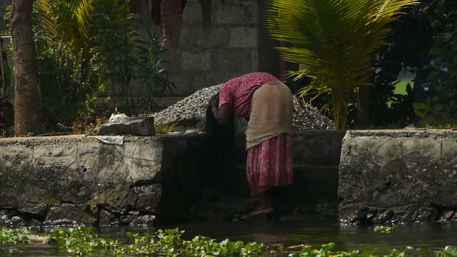 Hand-wash in a river, Kerala, India