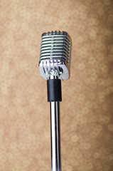 Fototapeta premium Old vintage microphone on background