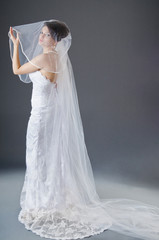 Fototapeta na wymiar Bride in wedding dress in studio shooting