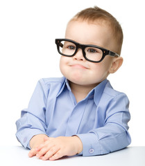 Portrait of a cute little boy wearing glasses