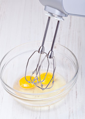 Wire whisk and eggs