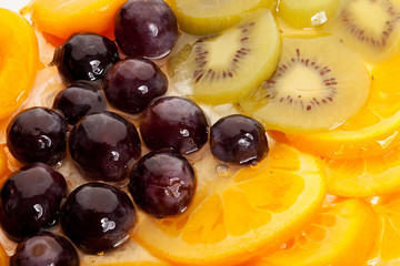 oranges, grapes, kiwi and peaches topping