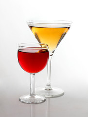 Glasses of yellow and red wine