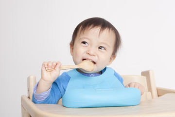 Cute baby with spoon