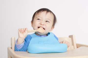 Cute baby with spoon