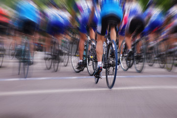 Fototapeta premium Blurred professional bike racers in a road race