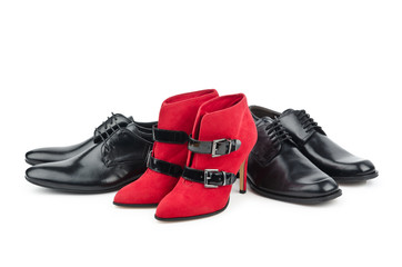 Male and female shoes on white