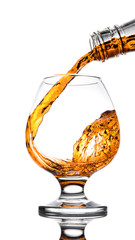 Whisky poured to glass from buttle with splashes