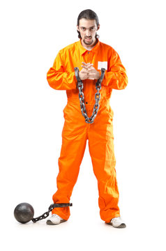 Criminal in orange robe in prison