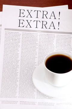 Newspaper EXTRA and a cup of coffee