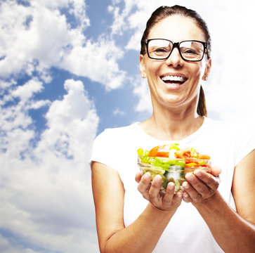 woman holding salad