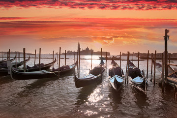 Venice with Gondolas against amazing sunset, Italy