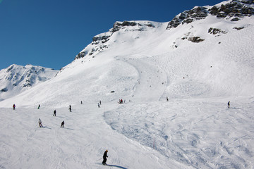 skiers on ski slopes in French Alps