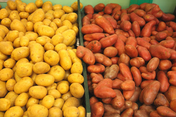 pile of potatoes on a market stall