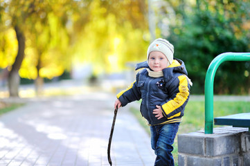 Adorable little boy  having fun outdoors