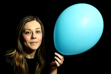 Woman with blue baloon