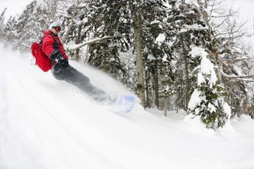 snowboarder on fresh deep snow
