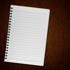 Blank notebook on old wood background