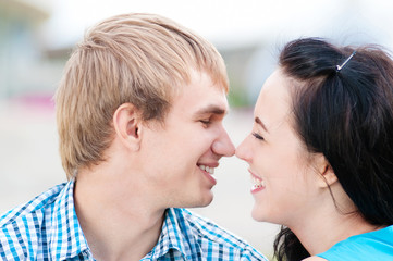 Fototapeta premium Portrait of a beautiful young happy smiling couple