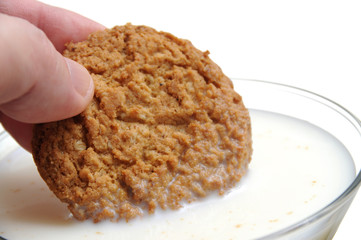 Eating cookie with milk