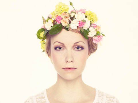 Beautiful young girl with flowers