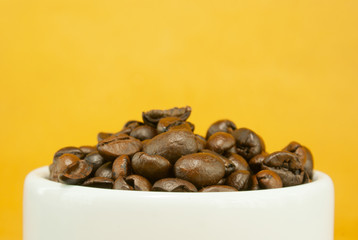 Cup full with coffee beans
