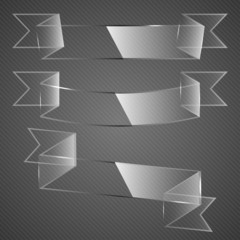 Glass ribbons on grey background.