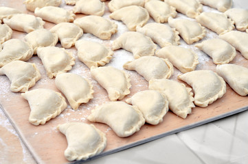 close-up of raw vareniks, traditional ukrainian food