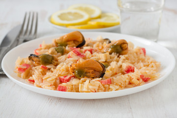 rice with seafood on the white plate