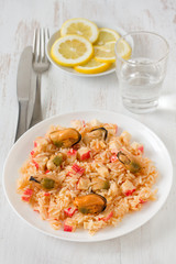 rice with seafood on the white plate