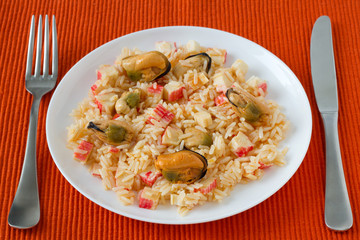 rice with seafood on the white plate