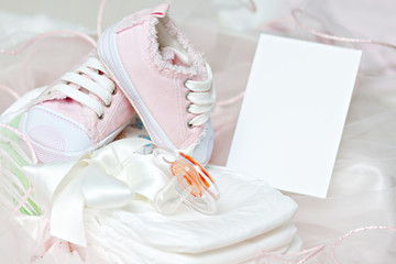 Baby shoes and pacifier on diapers. Photo Frame