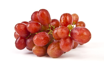 Red grapes on white background.