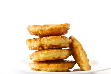 fried fritters on a white plate
