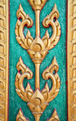 Thai Buddhist sculptures frescoes on the walls.