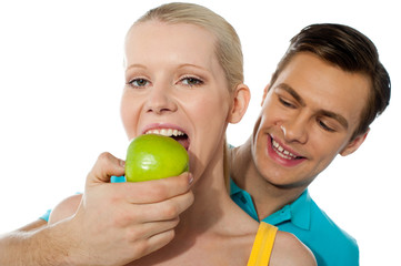 Fototapeta premium Love couple. Girlfriend eating an apple