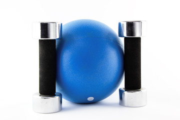 Blue fitness ball with silver hand weights standing straight