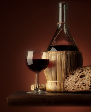red wine glass with bread and salami