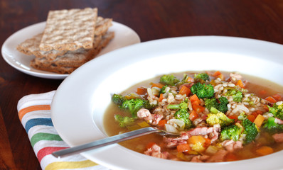 Rabbit soup with barley and vegetables with rye crisp bread