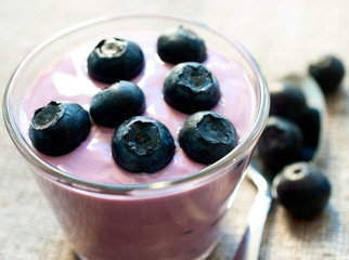Blueberry yogurt in a glass close up