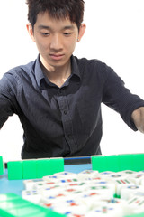 Fototapeta premium Chinese man play Mahjong, traditional China gamble.