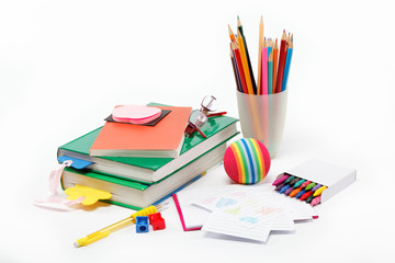 Fototapeta premium School supplies: books, notebook, pens, pencils, glasses, an app