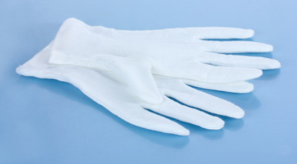 cloth gloves on blue background.