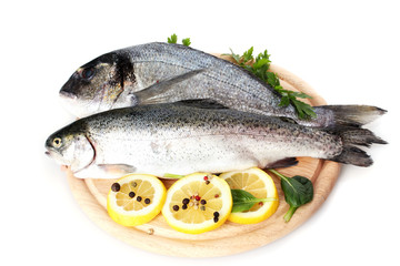Fresh fishes with lemon, parsley and spice