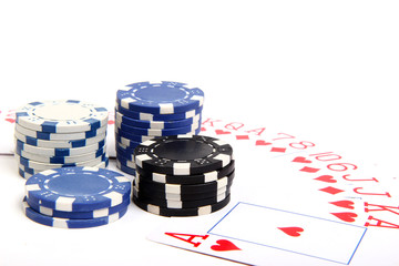 playing chips and poker card on white bacground