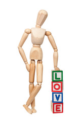 Wooden figurine with the word LOVE isolated on white background