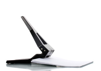 Black office hole punch with paper isolated on white