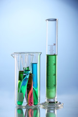 Laboratory glassware with color liquid and with reflection