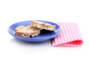 Bread snacks on saucer with napkin isolated on white
